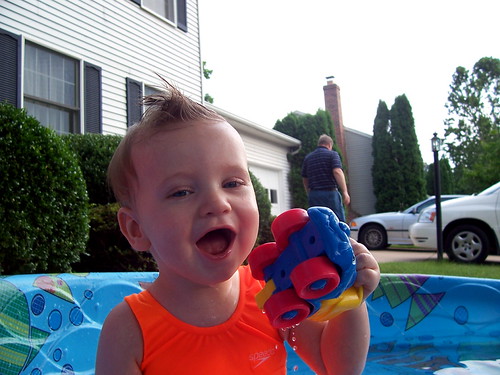 Brian very happy to be in the pool and eating a rubber ducky.