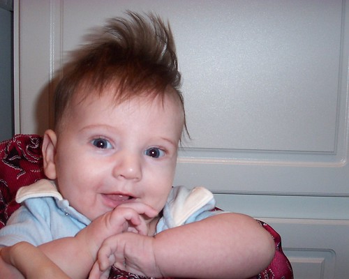 A very young Brian with very crazy hair.