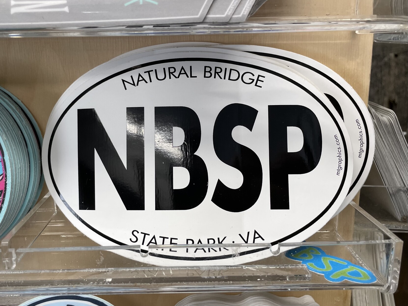 An oval-shaped sticker reading “NBSP” in big letters, and “NATURAL BRIDGE STATE PARK, VA” in small letters.